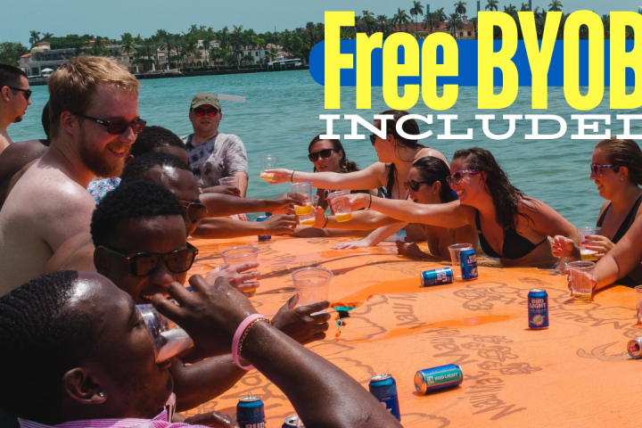 a group of people sitting at a beach
