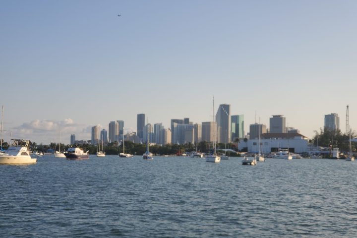 a large body of water with a city in the background