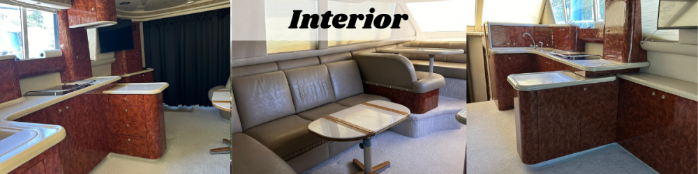 Luxurious boat interior with wood accents, leather seating, and a kitchenette.
